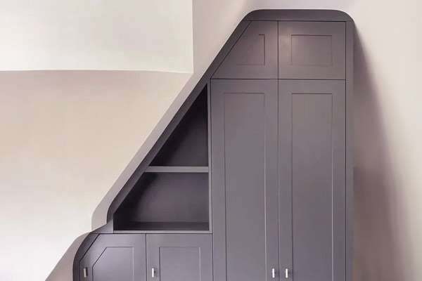 A fitted unit meeting a sloping ceiling without a visible gap