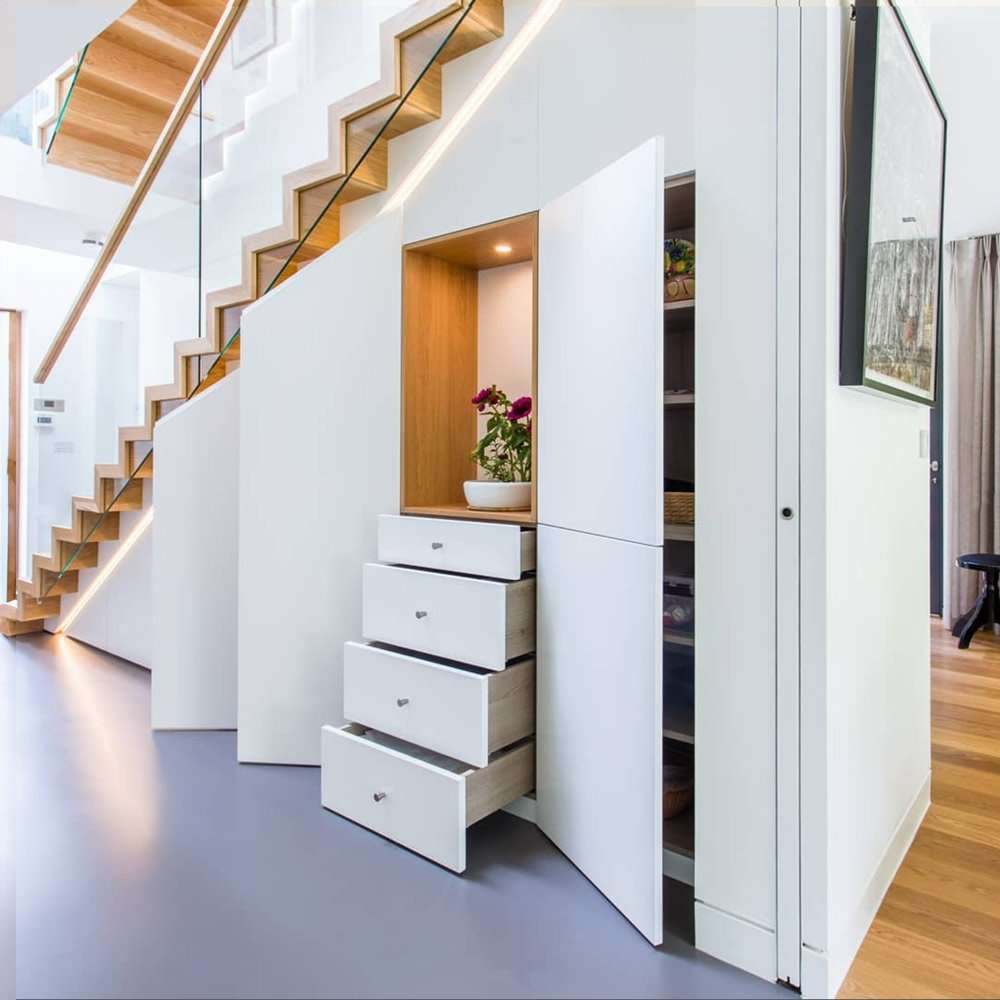 Bespoke understair storage in a London home